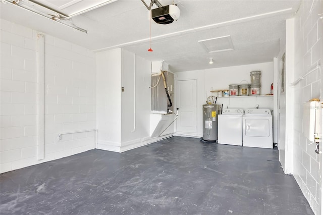 garage with heating unit, electric water heater, washer and clothes dryer, and a garage door opener