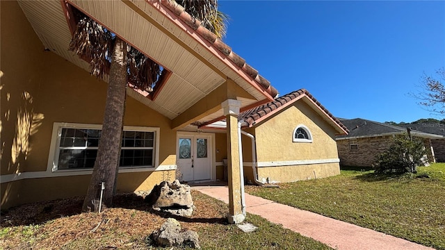 view of side of property with a yard