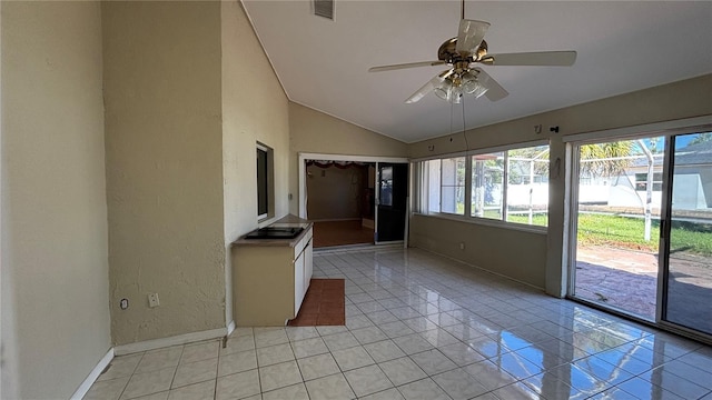 interior space with ceiling fan and lofted ceiling