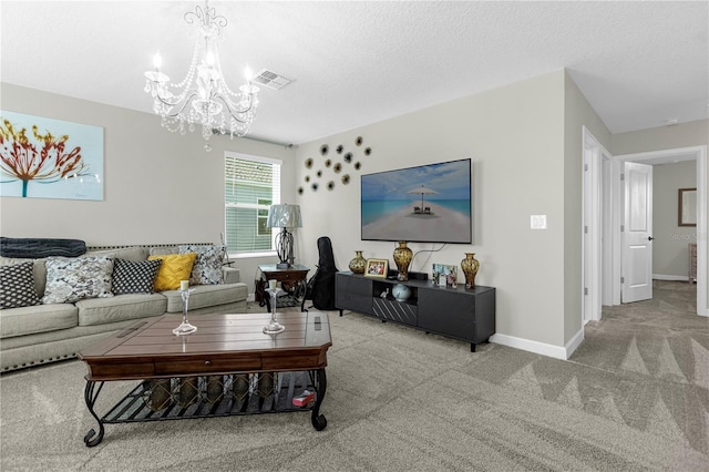 living room with light carpet, a textured ceiling, and a notable chandelier