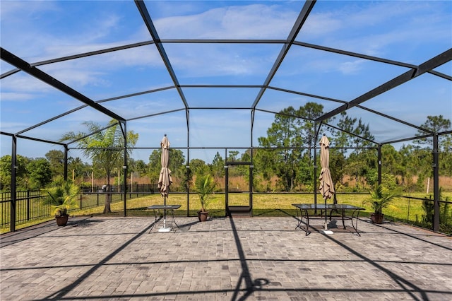 view of patio / terrace with a lanai