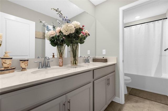 full bathroom featuring toilet, shower / bath combination with curtain, vanity, and tile patterned floors