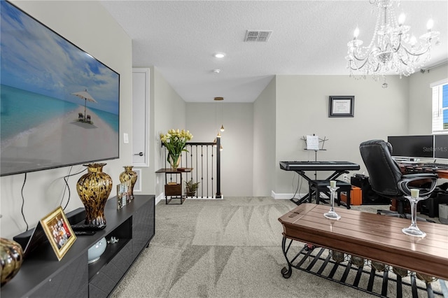 office featuring light colored carpet, a textured ceiling, and an inviting chandelier