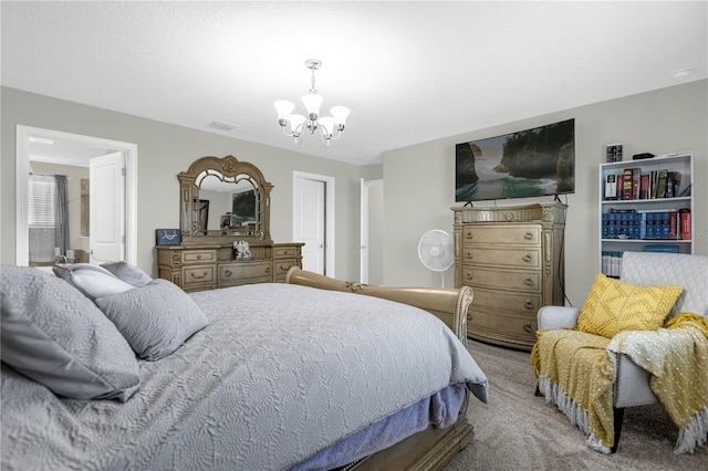 carpeted bedroom featuring an inviting chandelier