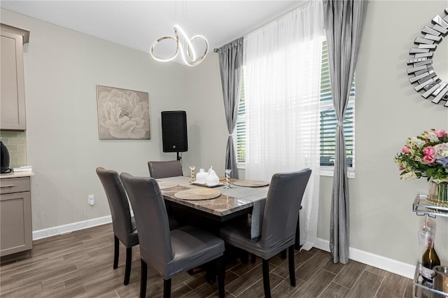 dining room with dark hardwood / wood-style flooring and a wealth of natural light