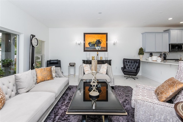 living room featuring sink