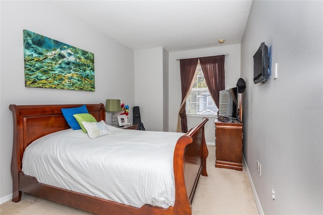 bedroom with light colored carpet