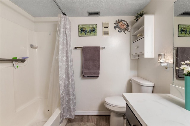 full bathroom featuring shower / tub combo, vanity, a textured ceiling, wood-type flooring, and toilet