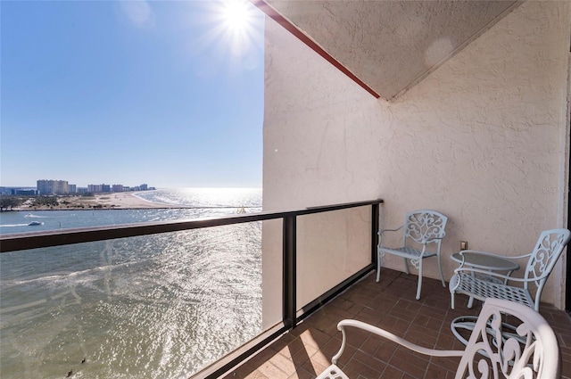 balcony featuring a water view