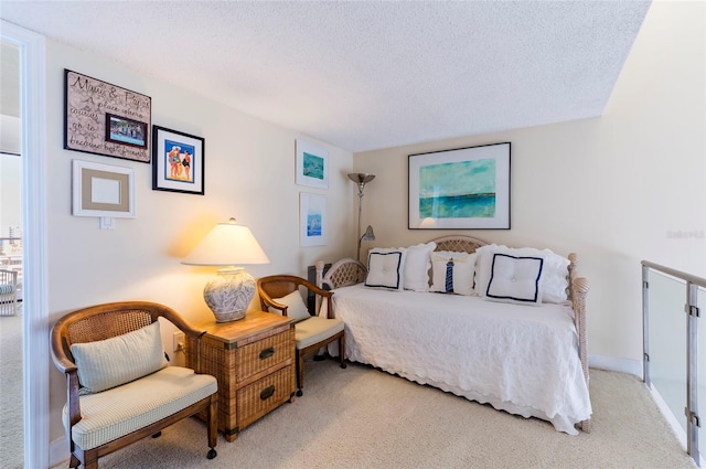 carpeted bedroom with a textured ceiling