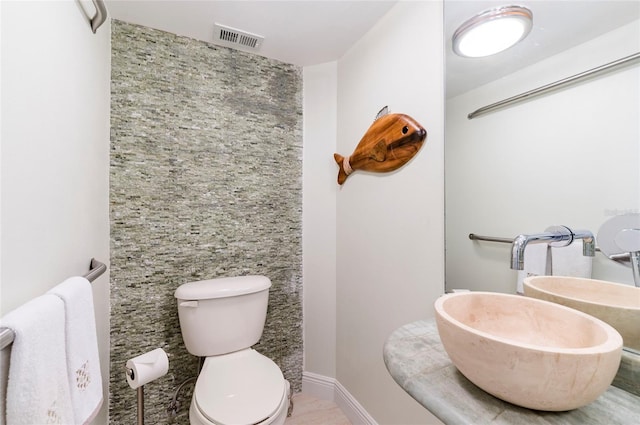 bathroom with sink and toilet