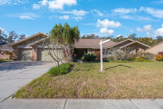 view of front of home featuring a front yard and a garage