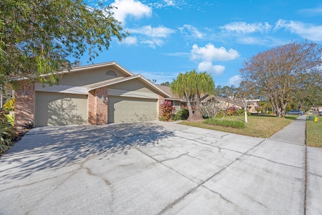 single story home with a front yard and a garage