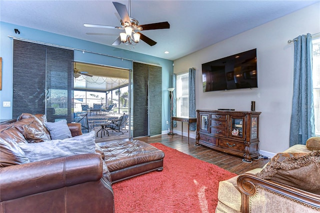 living room featuring a wealth of natural light, ceiling fan, and wood-type flooring