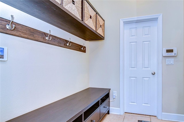 mudroom with light tile patterned flooring