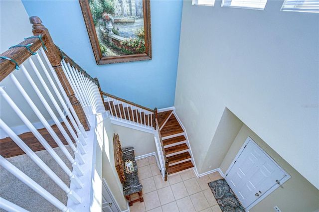 staircase with tile patterned floors