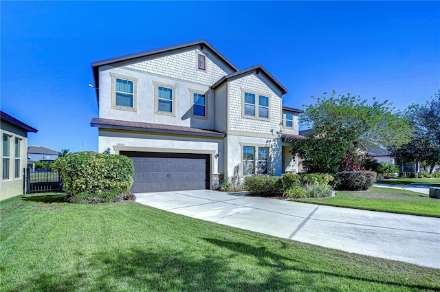 view of front of home with a garage and a front lawn