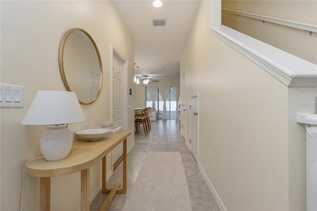 hallway with light tile patterned floors