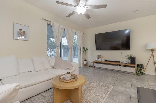 tiled living room featuring ceiling fan