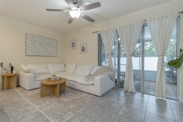 tiled living room featuring ceiling fan