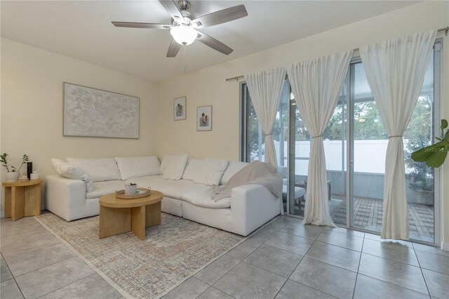 7013 Summer Holly Pl, Riverview, FL 33578 - living area featuring light tile patterned floors and a ceiling fan