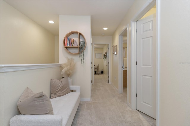 corridor with light colored carpet