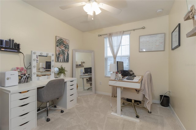 office featuring ceiling fan and light colored carpet