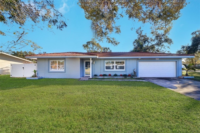 ranch-style home with a front yard and a garage