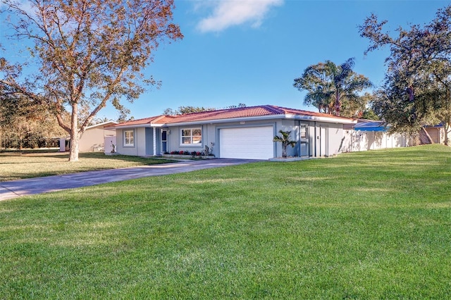 view of front facade featuring a garage and a front lawn