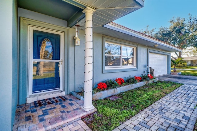 entrance to property featuring a garage