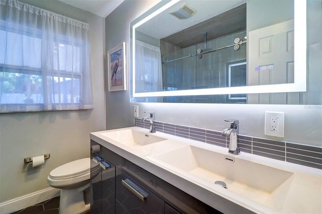 bathroom featuring walk in shower, vanity, and toilet