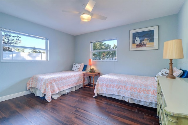 bedroom featuring ceiling fan and dark hardwood / wood-style floors