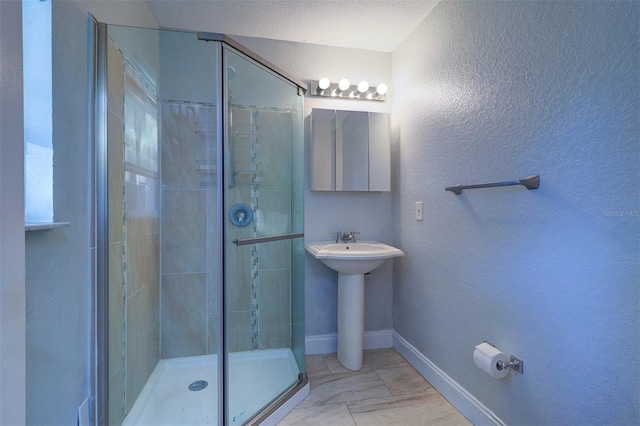 bathroom featuring sink and walk in shower