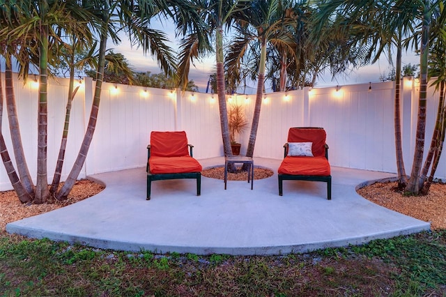 view of patio terrace at dusk