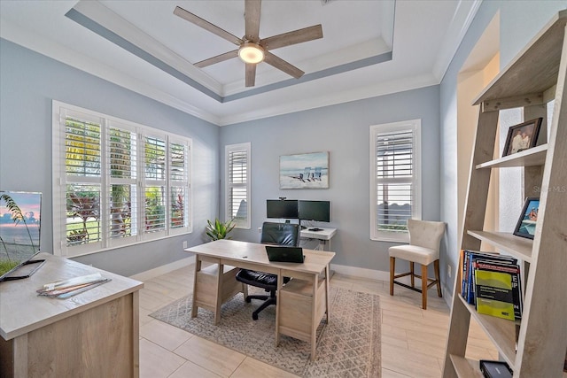 office with ceiling fan, ornamental molding, and a tray ceiling