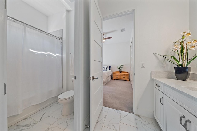 full bathroom with ceiling fan, toilet, vanity, and shower / tub combo with curtain