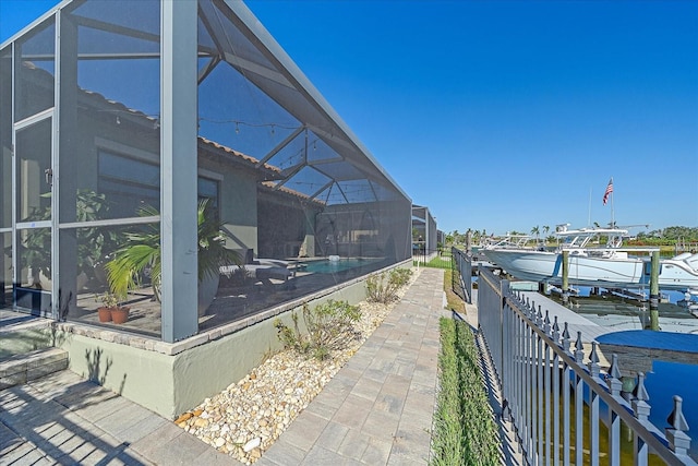 exterior space featuring a boat dock and a lanai