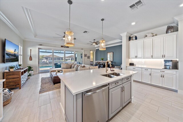 kitchen featuring dishwasher, open floor plan, a sink, and visible vents