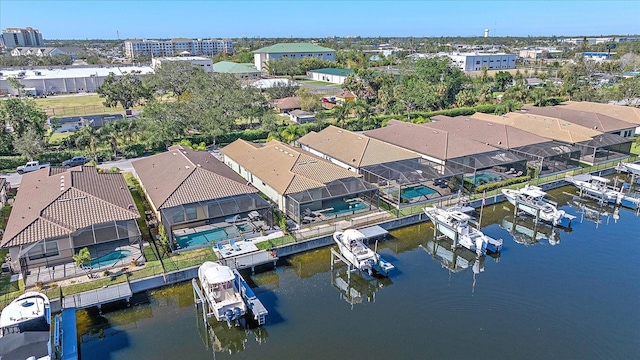 birds eye view of property featuring a water view and a residential view