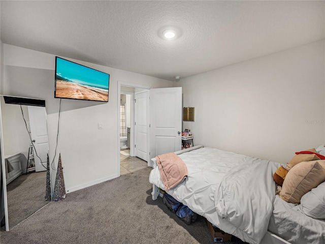 bedroom with a textured ceiling and light carpet