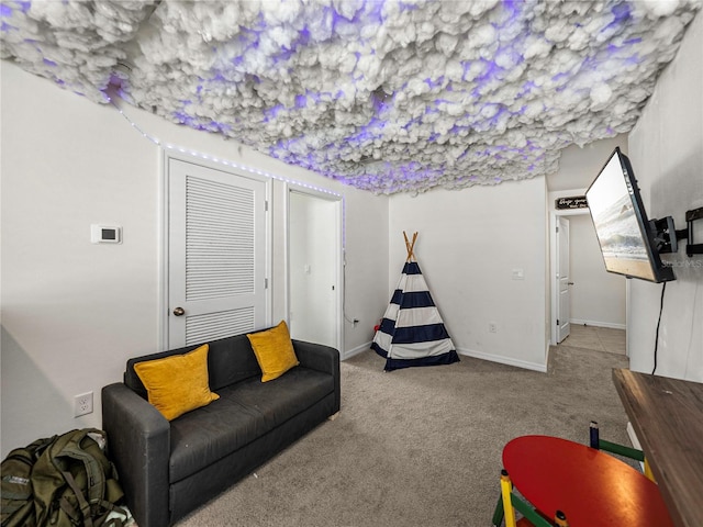 recreation room with light carpet