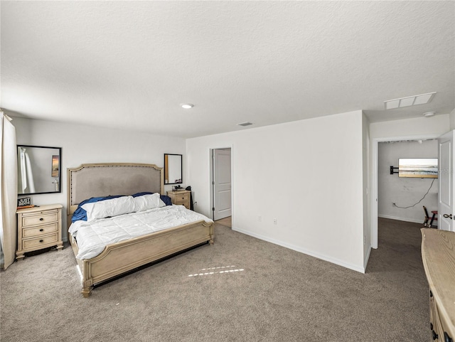 bedroom with carpet and a textured ceiling