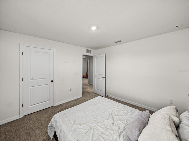 bedroom featuring dark carpet