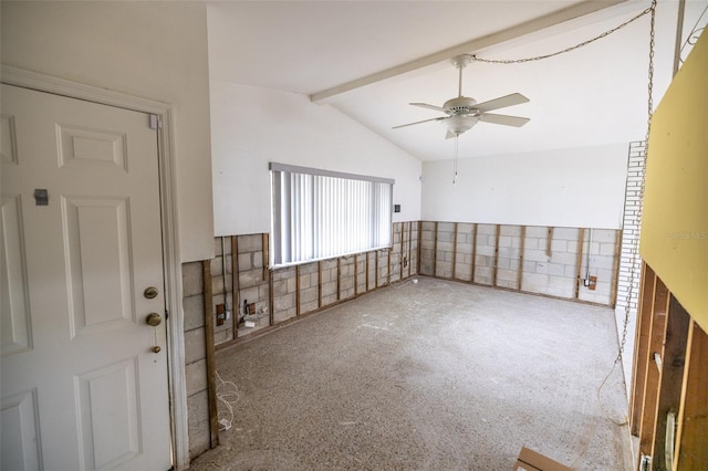 unfurnished room with carpet flooring, vaulted ceiling with beams, and ceiling fan