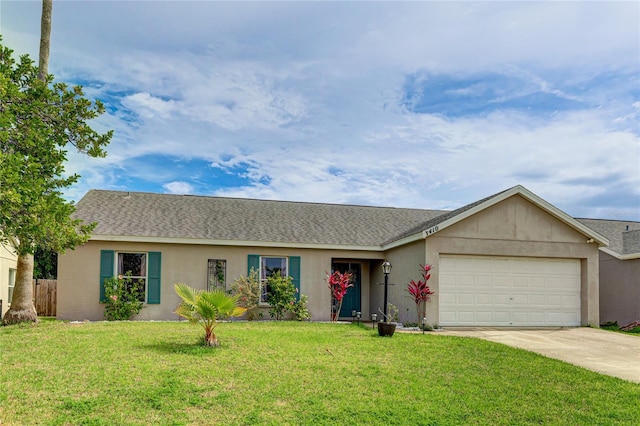 ranch-style home featuring a garage and a front lawn