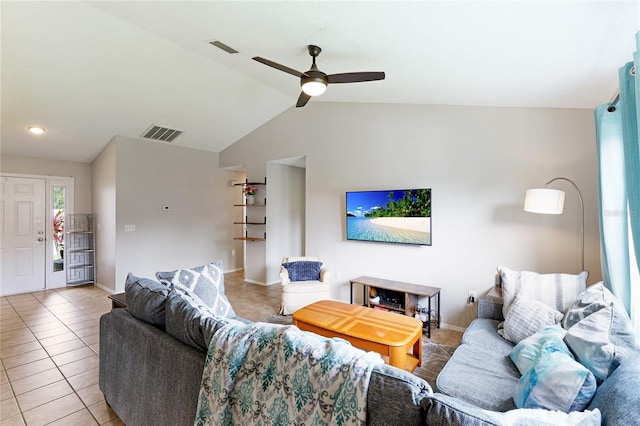 tiled living room with ceiling fan and lofted ceiling