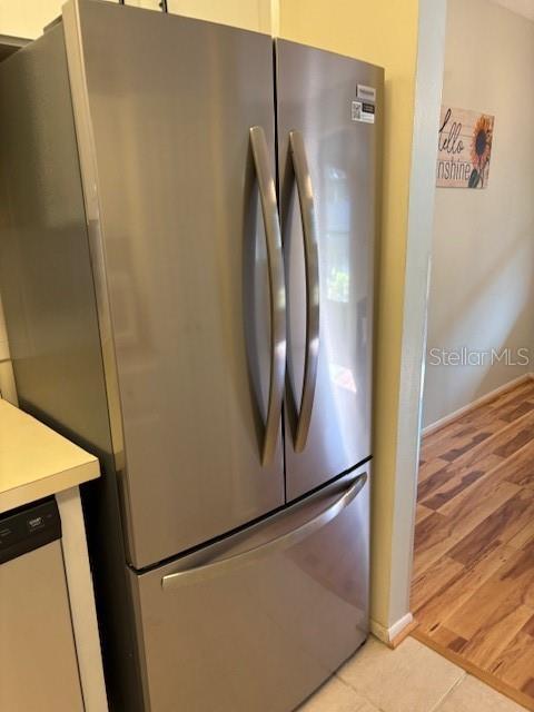 kitchen featuring stainless steel fridge and light wood-type flooring