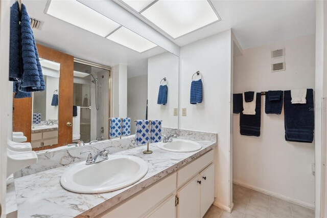 bathroom featuring vanity and tile patterned flooring