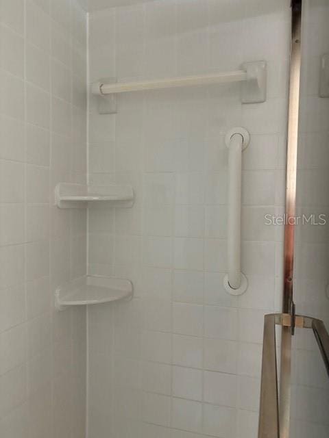 bathroom with an enclosed shower