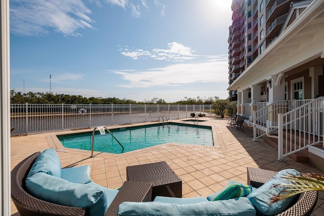 view of pool featuring a patio area